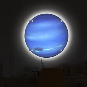 LED planet wall light detail shot, glowing blue celestial lamp showing unique texture.