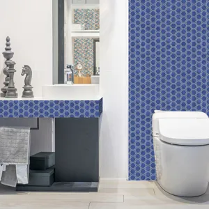 Blue hexagonal mosaic tile sticker, self-adhesive PVC wall decor for bathroom detail.