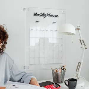Clear acrylic monthly planner board wall mounted memo calendar for office and home planning.