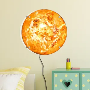 Detail view of the creative 3D LED glowing sun wall lamp mounted in a cozy room decor.