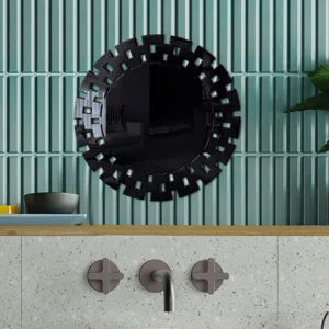 Decorative black acrylic round wall mirror detail featuring geometric mosaic frame design.