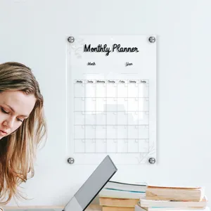 Clear acrylic monthly planner board detail, wall mounted dry erase calendar schedule board.
