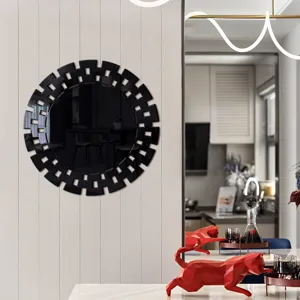 Decorative acrylic wall mirror sticker with geometric cutout design, modern home decor detail.