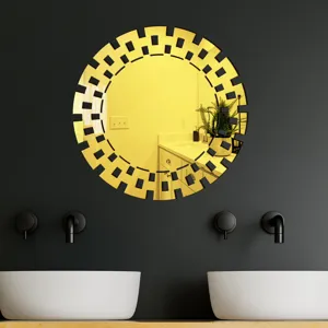 Round decorative acrylic wall mirror with golden geometric frame for modern home decor styling.