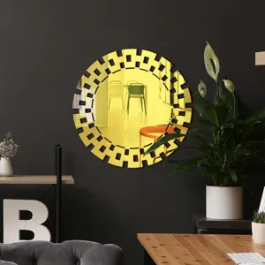 Detail view of the round decorative acrylic wall mirror with geometric frame in a modern room.
