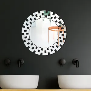 Acrylic decorative wall mirror with geometric round frame for modern home decor.