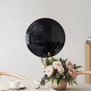 Round black acrylic wall mirror sticker with decorative edge dot patterns for home decor.