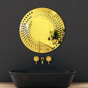 Detail view of round acrylic wall decorative mirror sticker with modern black dot pattern.