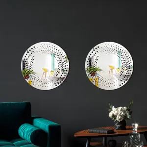 Detailed view of round decorative wall mirror featuring unique black dotted halftone pattern design.
