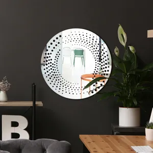 Round wall decorative mirror detail with black dot pattern, modern acrylic interior decor accent.