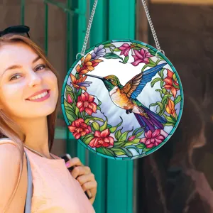 Detailed lifestyle view of circular stained glass hummingbird hanging wall decor piece.