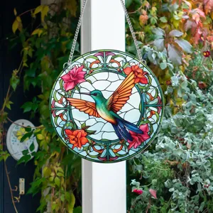 Detailed view of circular stained glass hummingbird hanging decoration for wall and garden.