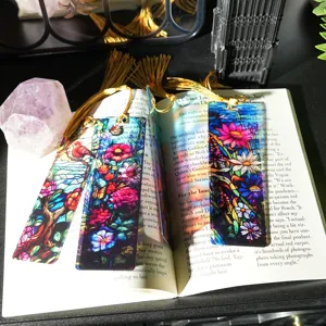 Stained glass translucent acrylic bookmark with gold tassel, artistic floral reading accessory.