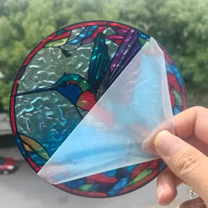 Acrylic hummingbird suncatcher detail shot, stained glass style window hanging decor peel.