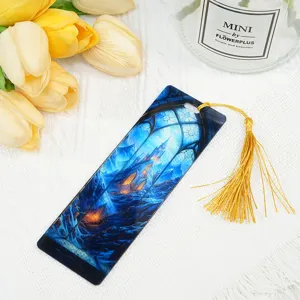 Acrylic dragon bookmark with yellow tassel, light-transmitting fantasy castle design for reading.