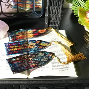 Stained glass acrylic bookmark detail, colorful translucent design with elegant gold tassel accent.