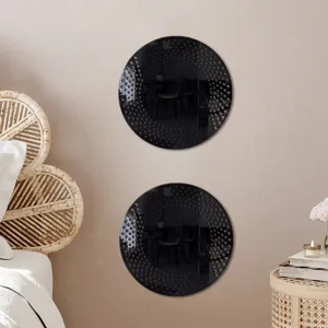 Detail view of round acrylic wall mirror sticker showing unique dot pattern in styled room decor.