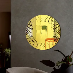 Modern decorative round acrylic wall mirror sticker with artistic black dot patterns.