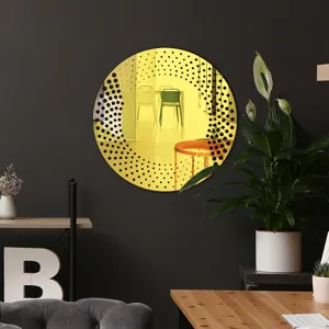 Round decorative wall mirror sticker with black dot pattern, modern acrylic home decor piece.
