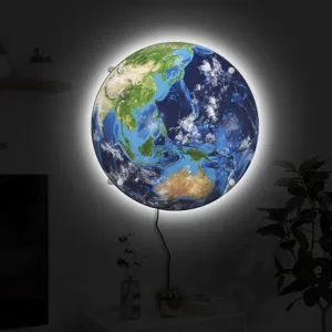 Detailed view of glowing 3D Earth wall lamp with vibrant continents and LED backlight effect.