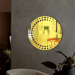 Close-up of circular acrylic decorative wall mirror with black dots, modern interior scene.