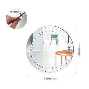 Detail view of the 30cm round wall decorative mirror, showing thickness and edge dot design.