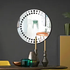 Modern round decorative wall mirror detail featuring unique dot pattern border, stylish home decor.