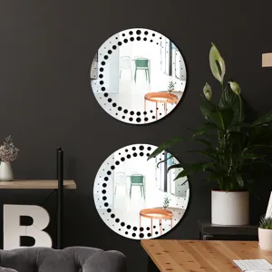 Detailed view of modern round acrylic wall mirror with stylish dot pattern decor.