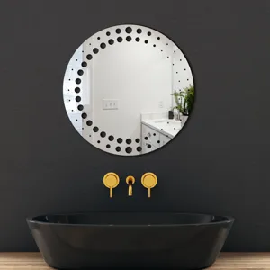 Modern round decorative wall mirror featuring unique black dot border design for home and bathroom.