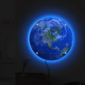 Detailed view of the 3D LED earth wall lamp with glowing blue ambient light in room.