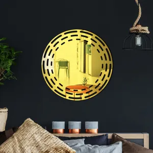 Detailed view of a round decorative acrylic wall mirror with hollow geometric patterns.