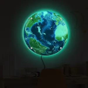 Detailed view of glowing earth wall lamp with green LED backlight mounted in a cozy room.
