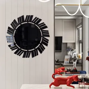 Modern black acrylic decorative wall mirror sticker, unique geometric sunburst design detail.