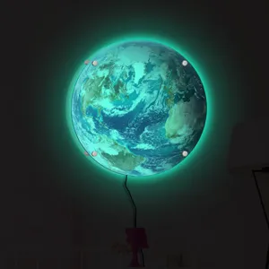 Detailed view of glowing earth wall lamp with green LED backlighting for creative home decor.