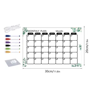 Acrylic monthly planner calendar board detail featuring dry erase markers, rope and hanging hook.