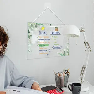 Clear acrylic hanging memo board with to-do list and green leaf pattern for home office.