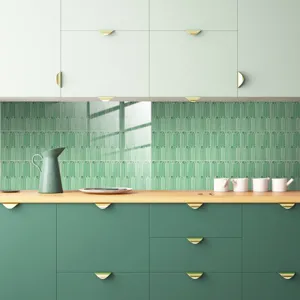Detailed view of kitchen wall tile sticker featuring a stylish peacock feather pattern in green.