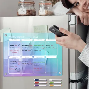 Acrylic weekly planner magnetic fridge board showing daily schedule setup in home kitchen.