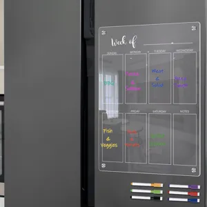 Clear acrylic magnetic weekly planner board for fridge with dry erase markers and pen holder.