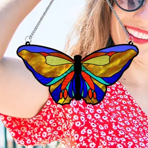 Beautiful stained glass style acrylic butterfly hanging ornament detail shot with silver chain.