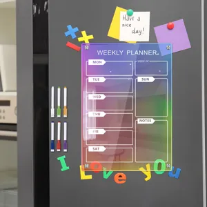 Acrylic magnetic weekly planner board with erasable markers and colorful fridge magnets for home.