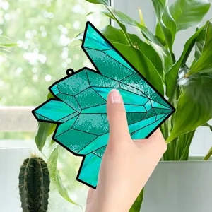 Acrylic crystal bird window hanging decor detail, vibrant turquoise geometric glass sign.