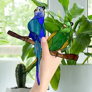 Colorful stained acrylic double parrot branch hanging ornament for home decor and window display.
