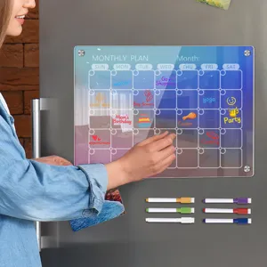 Acrylic monthly calendar magnetic dry erase board with colorful markers for fridge schedule planning.