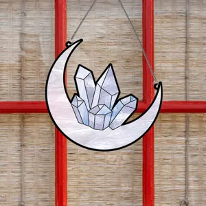Detailed view of stained glass crescent moon and crystal hanging suncatcher ornament for home.