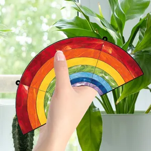 Acrylic rainbow window hanging decor, vibrant colored suncatcher pendant for home wall room.
