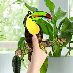 Close-up of stained glass toucan hanging acrylic ornament, showing colorful details and texture.