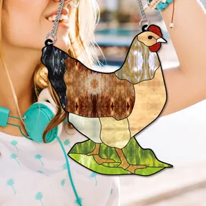 Acrylic stained glass rooster hanging ornament detail showing colorful pattern and metal chain.