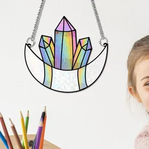 Detail shot of a colorful crystal moon hanging ornament with chain, perfect for home window decor.