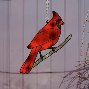 Close-up detail of the vibrant red cardinal acrylic hanging ornament with metallic chain.